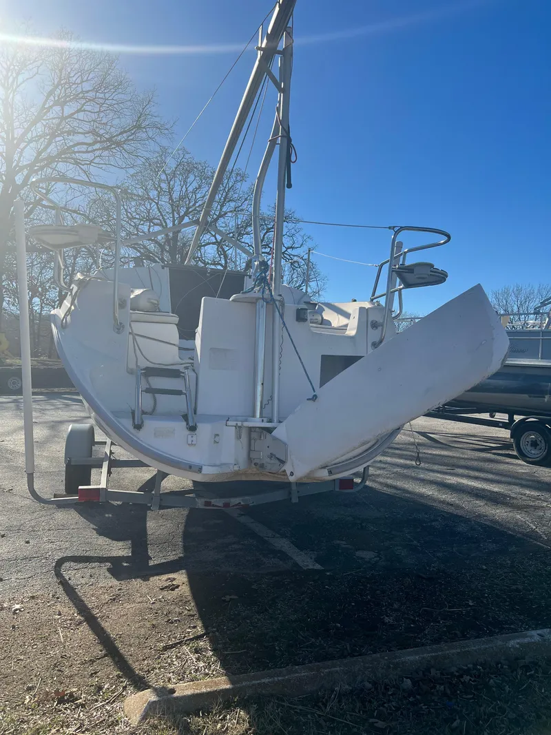 Slide: The Image of 2002 Hunter 240 sailboat on trailer, rear view, sunny day. - 3