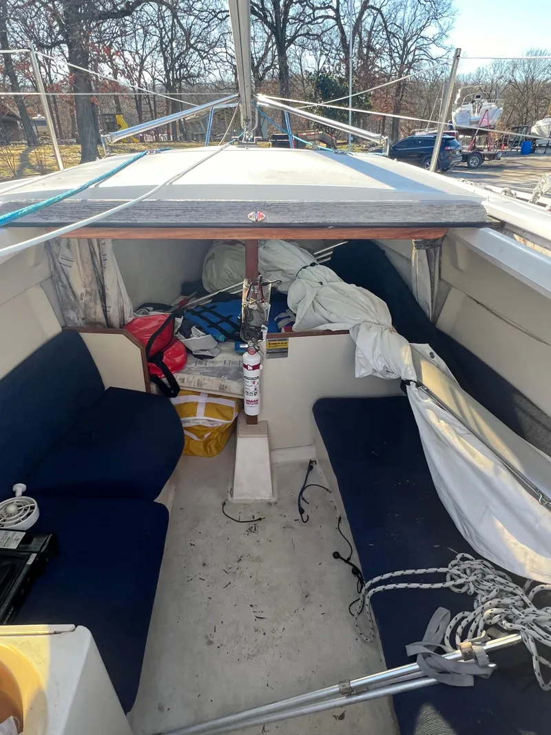 Slide: The Image of Interior of a 2002 Hunter 240 sailboat with seating and storage. - 8