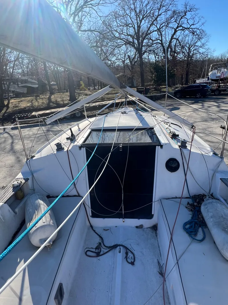 Slide: The Image of 2002 Hunter 240 sailboat cockpit with rigging and ropes. - 9