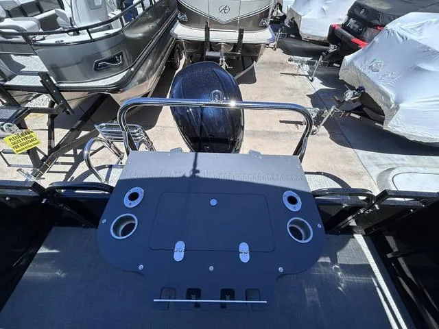Slide: The Image of 2024 Avalon Catalina Rear Fish 23 FT boat with motor and fishing setup. - 13