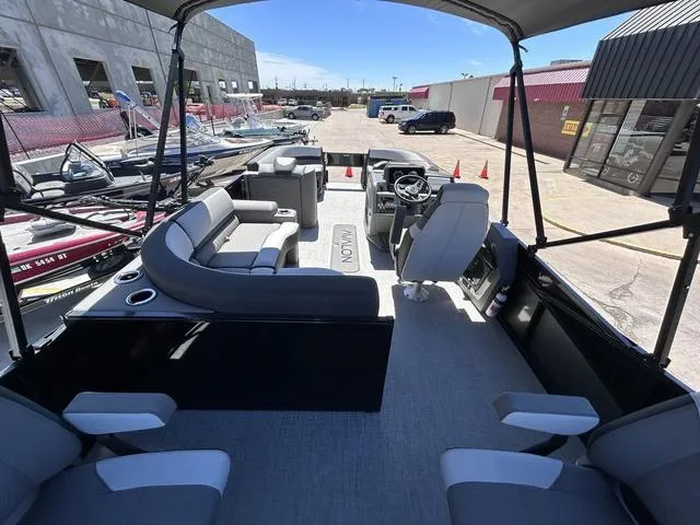 Slide: The Image of 2024 Avalon Catalina Rear Fish 23 FT pontoon boat interior with seating and steering console. - 14