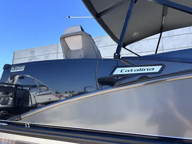Slide: The Image of 2024 Avalon Catalina Rear Fish 23 FT boat side view with branding. - 3