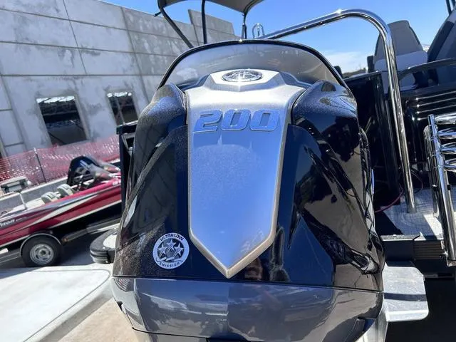 Slide: The Image of 2024 Avalon Catalina Rear Fish 23 FT boat with a 200 HP engine. - 6