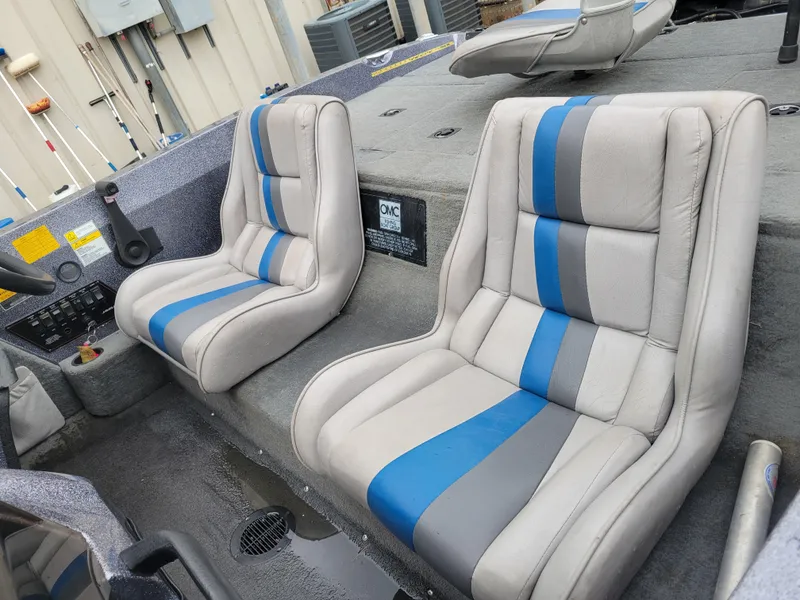 Slide: The Image of 1994 Javelin 379 boat interior with gray and blue seats. - 9
