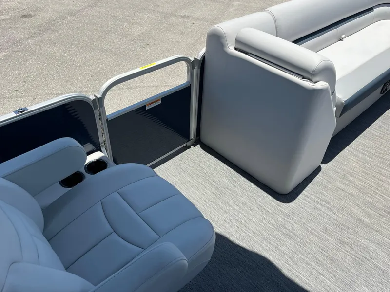 Slide: The Image of 2022 Godfrey SWEETWATER 2486 SFL pontoon boat interior with gray seating and flooring. - 14