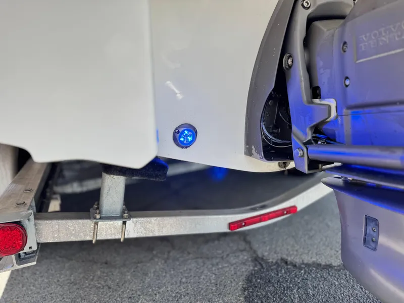 Slide: The Image of 2016 Monterey 244FS boat trailer with blue LED light and Volvo Penta engine. - 10