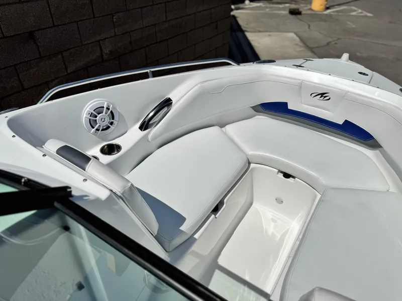 Slide: The Image of 2016 Monterey 244FS boat interior with white seating and speaker system. - 15