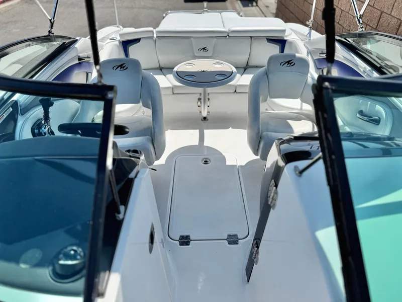 Slide: The Image of 2016 Monterey 244FS boat interior with seating and table, showcasing luxury design. - 19