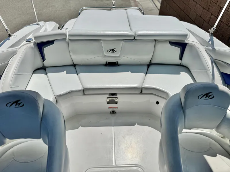 Slide: The Image of 2016 Monterey 244FS boat interior with white seating and logo detailing. - 21