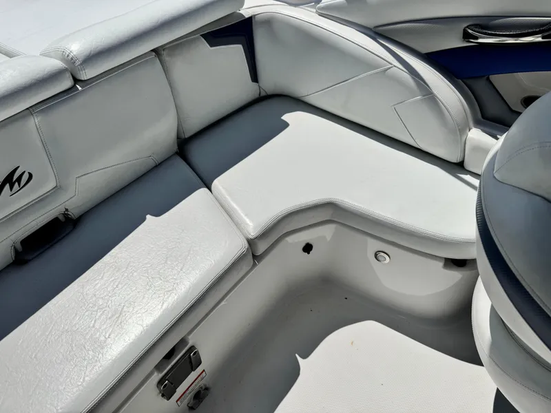 Slide: The Image of 2016 Monterey 244FS boat interior with white leather seating and sleek design. - 26