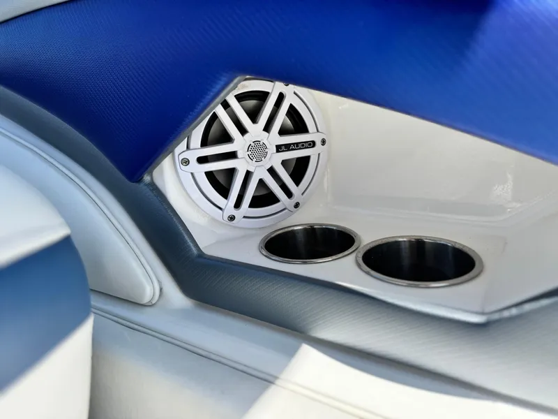 Slide: The Image of Speaker and cup holders in 2016 Monterey 244FS boat interior. - 27