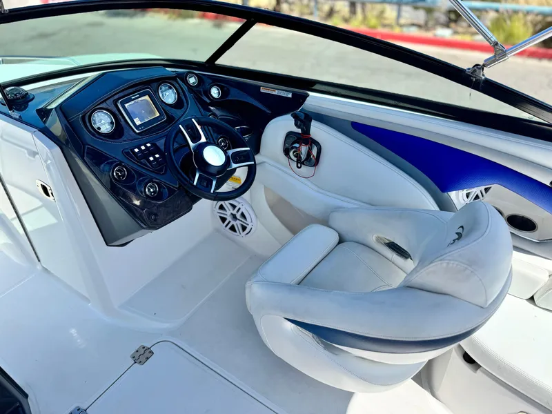 Slide: The Image of 2016 Monterey 244FS boat interior with steering wheel and dashboard controls. - 32
