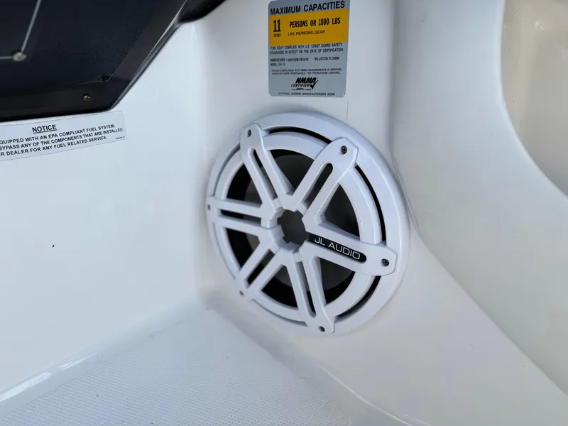 Slide: The Image of Speaker on 2016 Monterey 244FS boat, featuring JL Audio and capacity warning label. - 35
