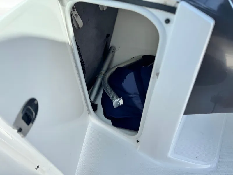 Slide: The Image of Storage compartment in a 2016 Monterey 244FS boat, showing interior equipment. - 37