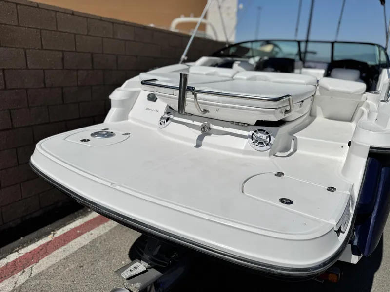 Slide: The Image of 2016 Monterey 244FS boat rear view with swim platform and seating. - 7