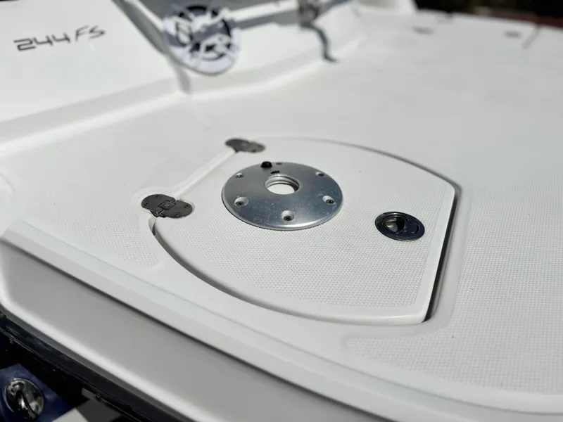 Slide: The Image of 2016 Monterey 244FS boat deck with metal fittings and textured surface. - 8