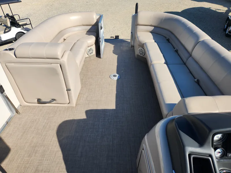 Slide: The Image of 2018 Ranger Reata 220C pontoon boat with beige seating and spacious deck. - 8