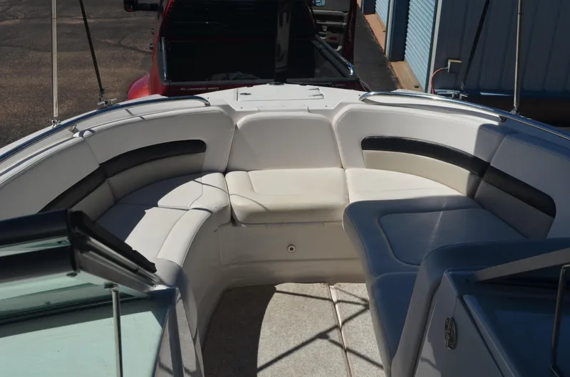 Slide: The Image of 2008 Chaparral 284 Sunesta boat interior with cushioned seating area. - 7