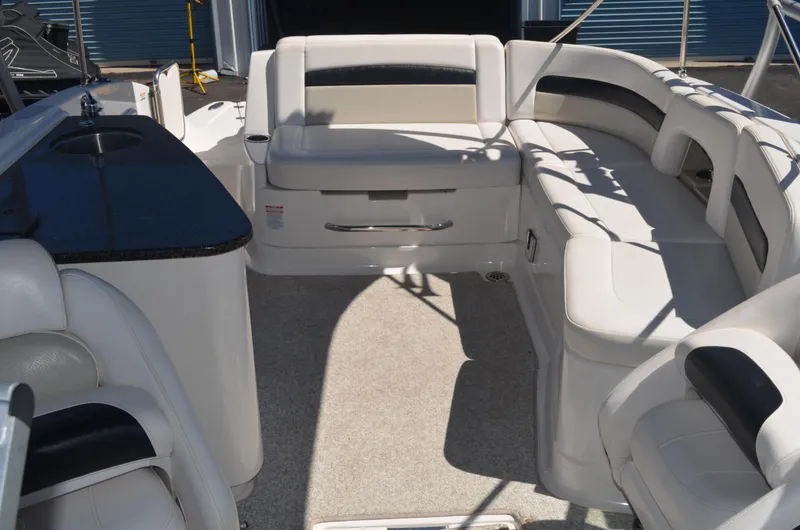 Slide: The Image of 2008 Chaparral 284 Sunesta boat interior with white seating and black accents. - 8