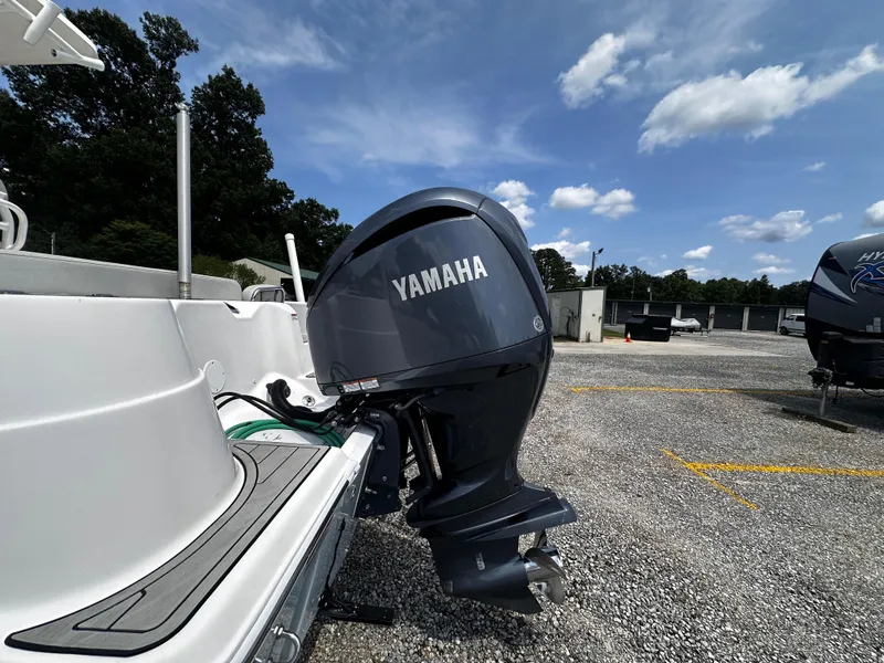Slide: The Image of 2022 Sea Fox 249 Avenger with Yamaha outboard motor in parking lot. - 10