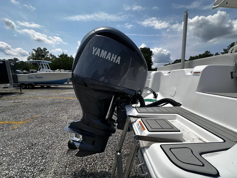 Slide: The Image of 2022 Sea Fox 249 Avenger with Yamaha outboard motor in a boatyard. - 11