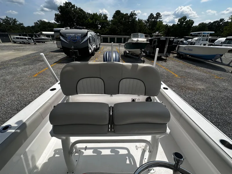 Slide: The Image of 2022 Sea Fox 249 Avenger boat with dual seats, parked in a marina. - 18