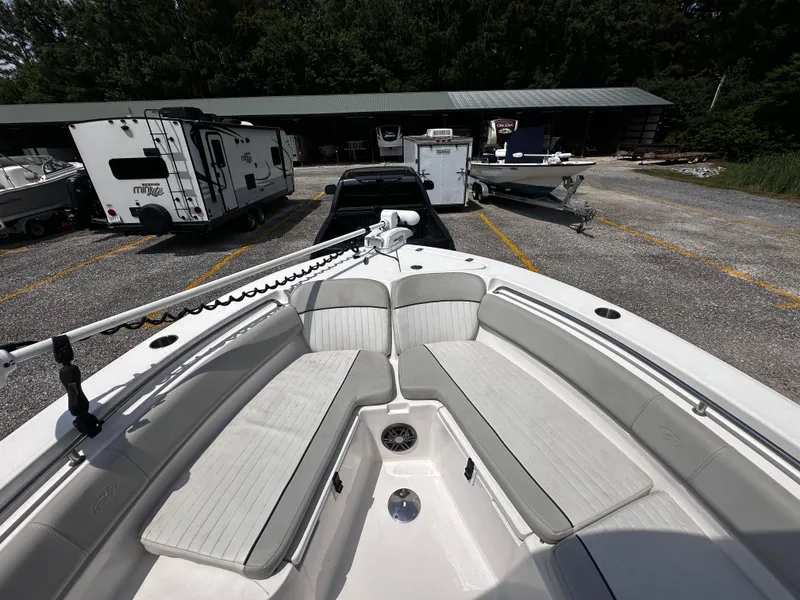 Slide: The Image of 2022 Sea Fox 249 Avenger boat with spacious bow seating in a storage lot. - 19