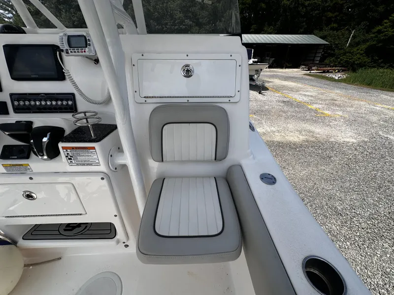 Slide: The Image of 2022 Sea Fox 249 Avenger boat interior with seating and control panel. - 24