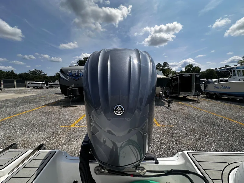 Slide: The Image of 2022 Sea Fox 249 Avenger with Yamaha outboard motor in a parking lot. - 25