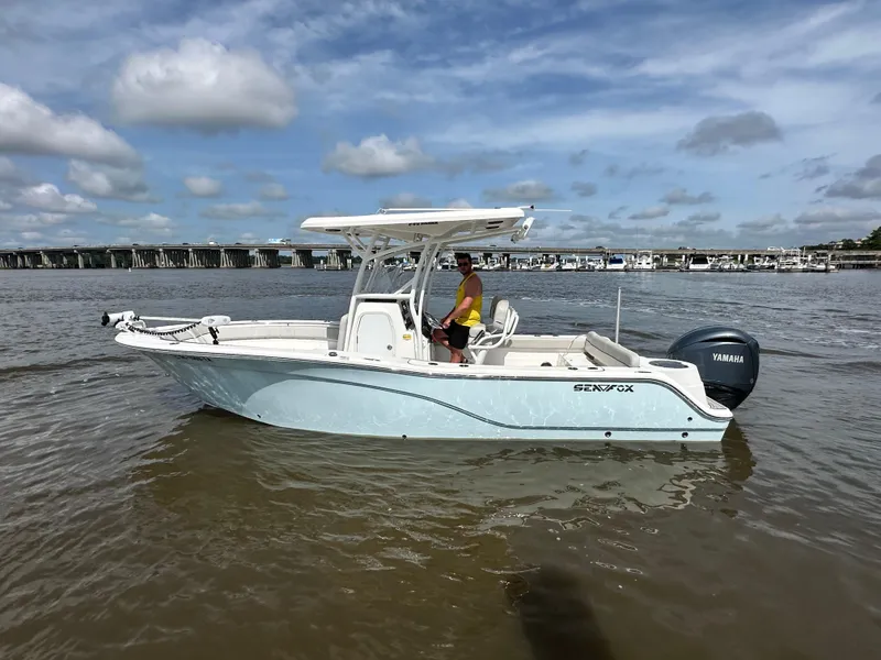 Slide: The Image of 2022 Sea Fox 249 Avenger boat on water with Yamaha outboard motor. - 3
