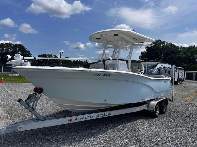 Slide: The Image of 2022 Sea Fox 249 Avenger boat on trailer under blue sky. - 6