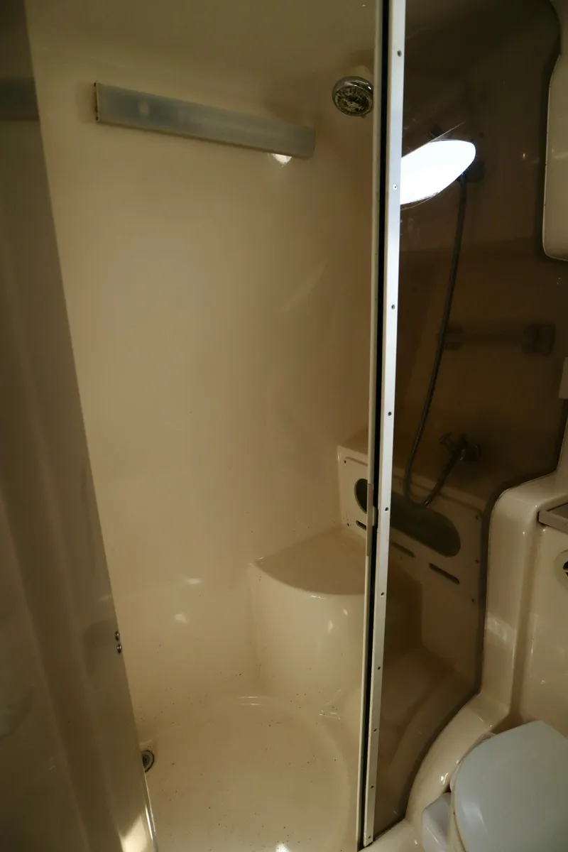 Slide: The Image of Bathroom in 2002 Rinker 342 Fiesta Vee boat with shower and toilet. - 12