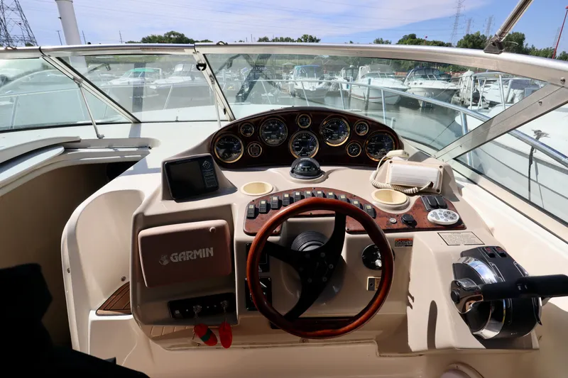 Slide: The Image of 2002 Rinker 342 Fiesta Vee boat helm with Garmin navigation system and control panel. - 13