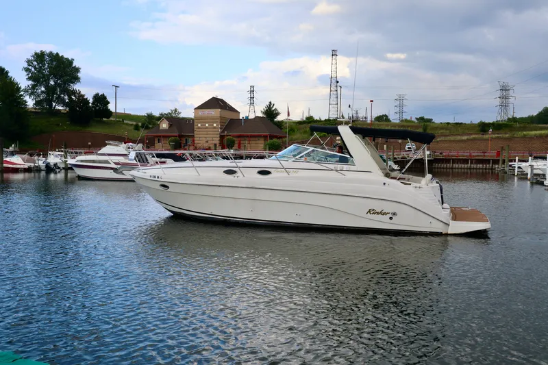 Slide: The Image of 2002 Rinker 342 Fiesta Vee boat docked in a marina. - 20