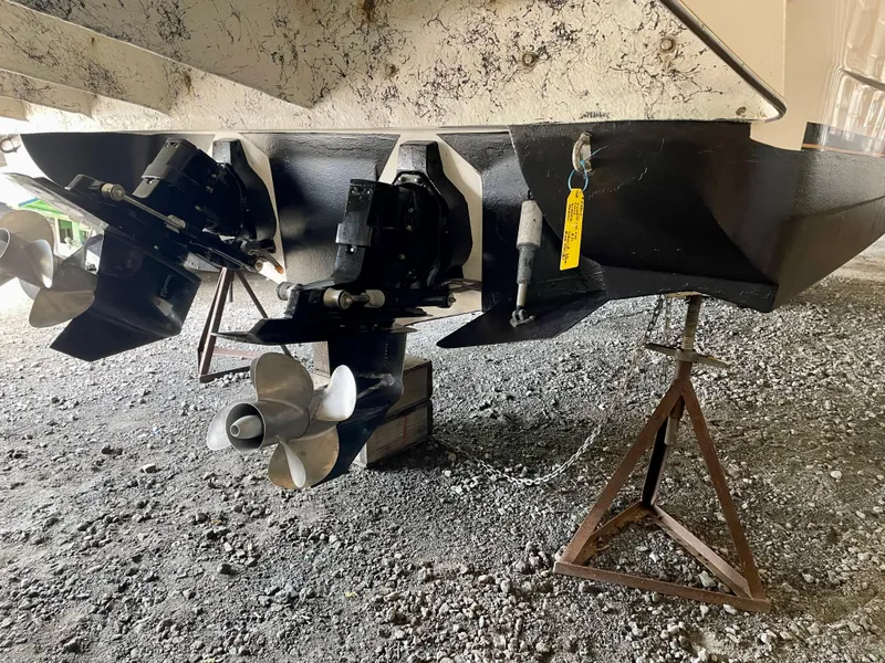 Slide: The Image of 2002 Rinker 342 Fiesta Vee boat propellers and stern on a stand. - 30