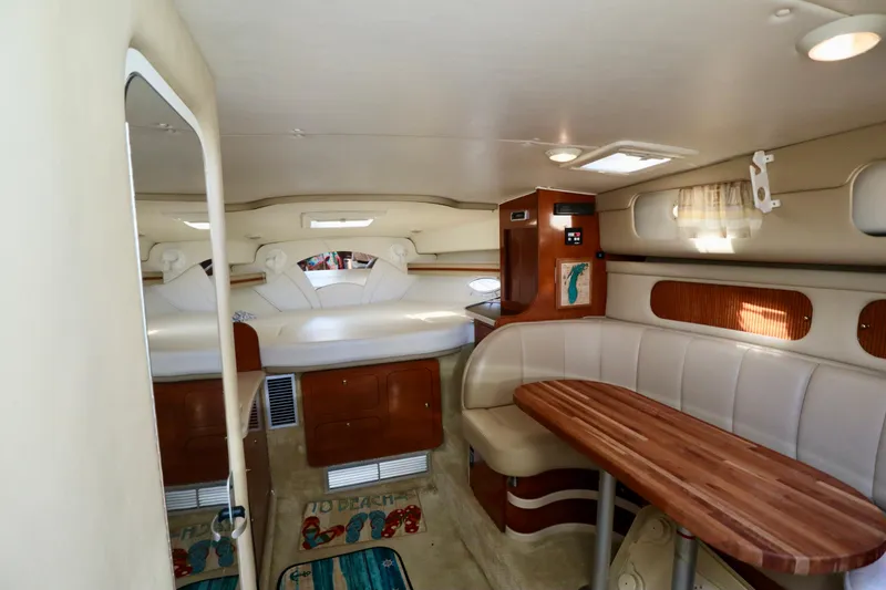 Slide: The Image of Interior of 2002 Rinker 342 Fiesta Vee boat with seating and sleeping area. - 9