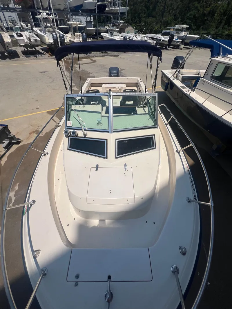 Slide: The Image of 1989 Grady-White Seafarer 226 boat docked at a marina. - 13