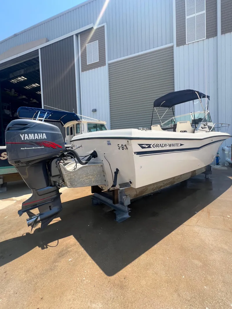 Slide: The Image of 1989 Grady-White Seafarer 226 boat with Yamaha outboard motor in a boatyard. - 7