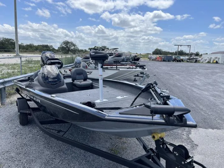 Slide: The Image of 2024 Tracker Pro Team 175 TF fishing boat on trailer, parked outdoors. - 12