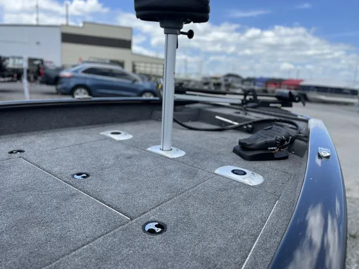 Slide: The Image of 2024 Tracker Pro Team 175 TF boat deck with fishing seat and storage compartments. - 13