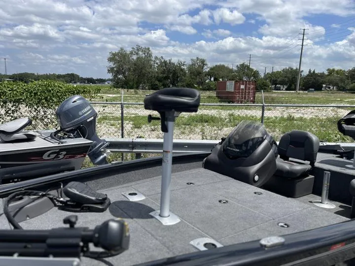 Slide: The Image of 2024 Tracker Pro Team 175 TF fishing boat with seating and motor. - 3