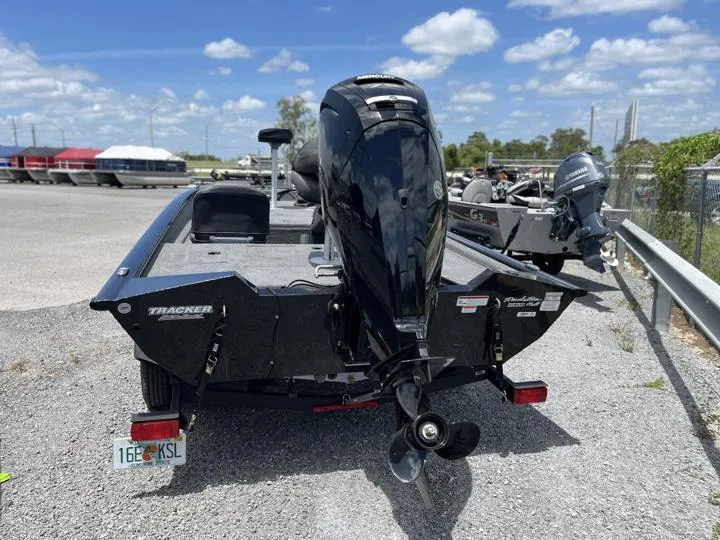 Slide: The Image of 2024 Tracker Pro Team 175 TF boat with outboard motor, rear view. - 6