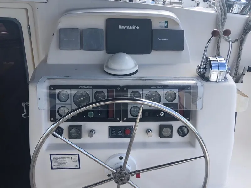 Slide: The Image of Steering wheel and control panel of 2003 Leopard 47 catamaran. - 17