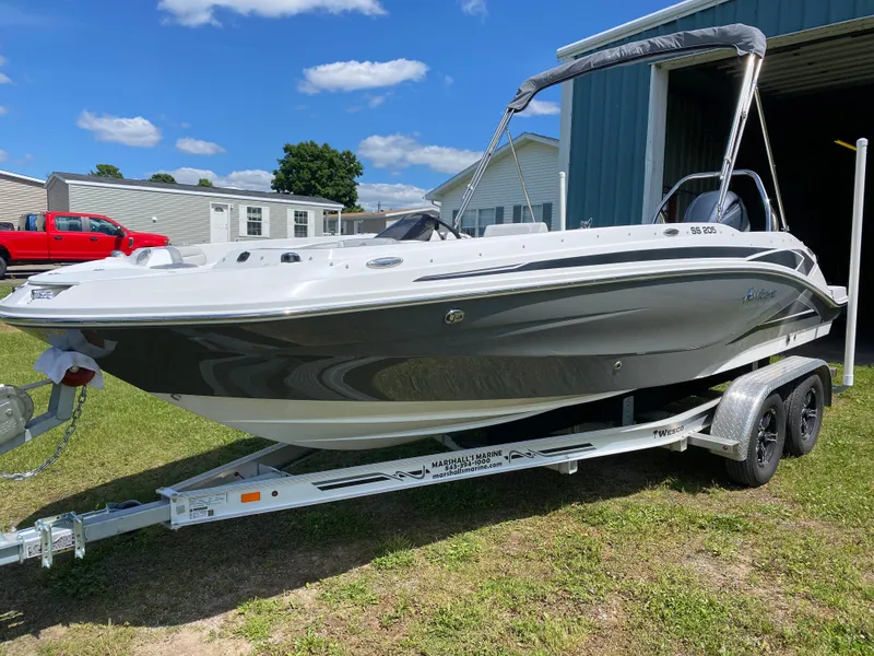 The Image of 2022 Hurricane SS 205 boat on trailer, parked outdoors under blue sky. - 0
