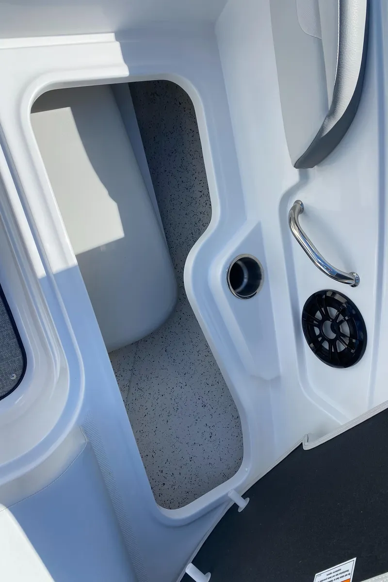 Slide: The Image of 2022 Hurricane SS 205 boat interior with storage compartment and speaker. - 10