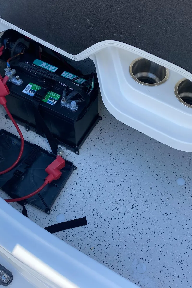 Slide: The Image of Battery compartment of 2022 Hurricane SS 205 boat with cup holders. - 13