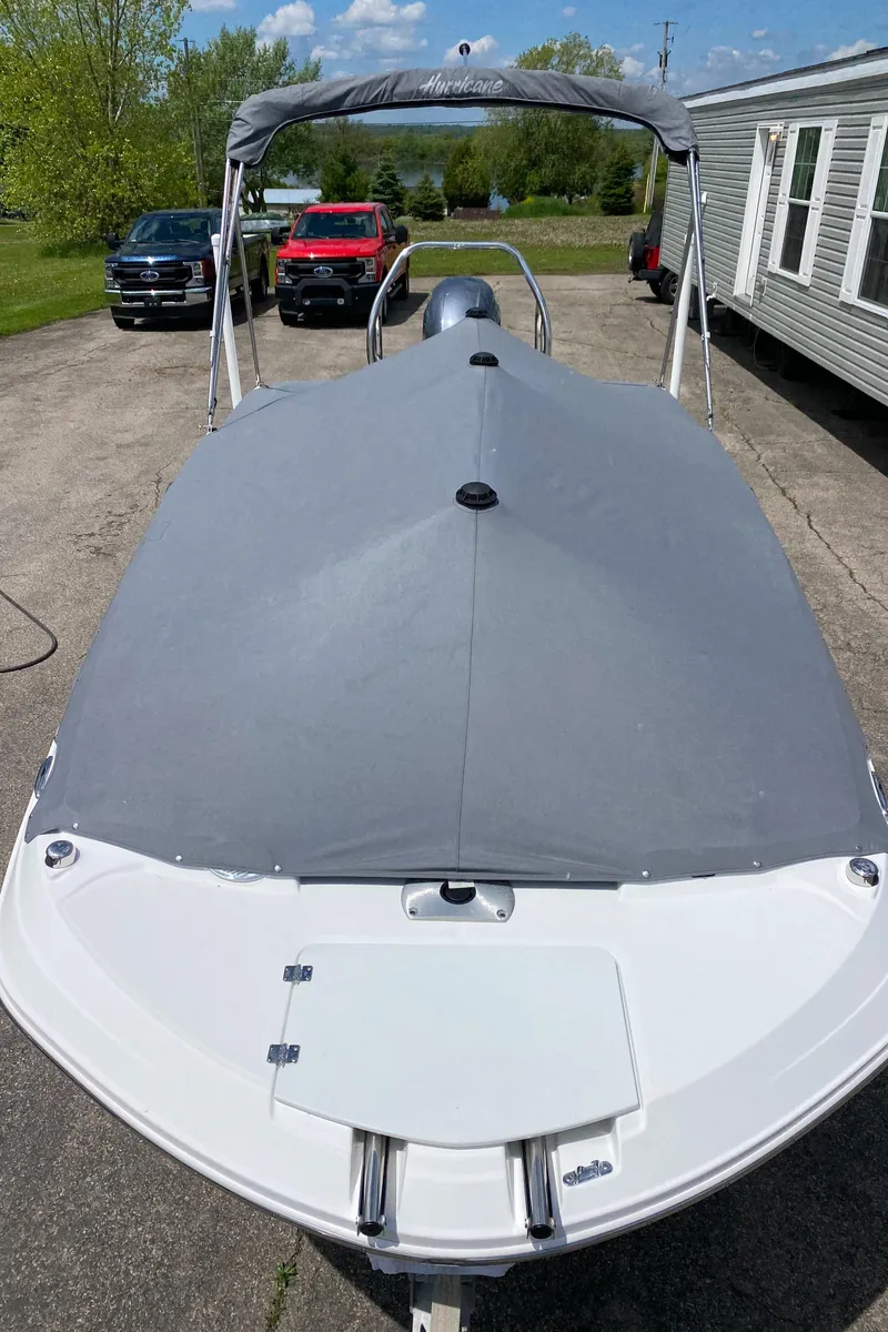 Slide: The Image of 2022 Hurricane SS 205 boat with cover, parked on driveway, sunny day. - 20