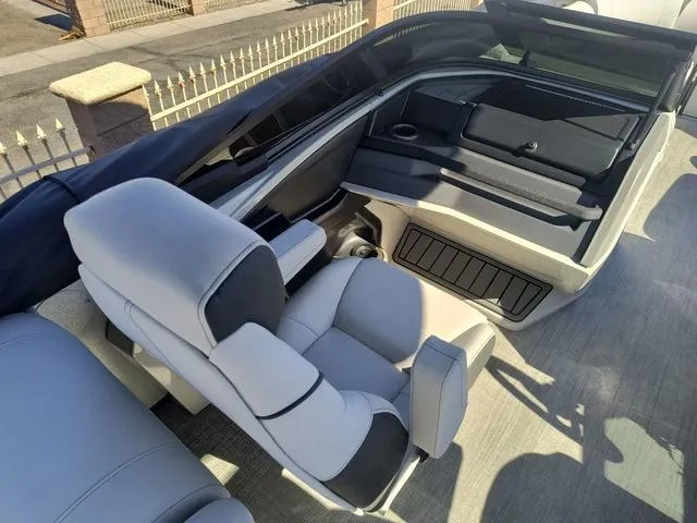 Slide: The Image of 2024 Tahoe Cascade Quad Lounge Windshield 25 FT interior with spacious seating. - 11