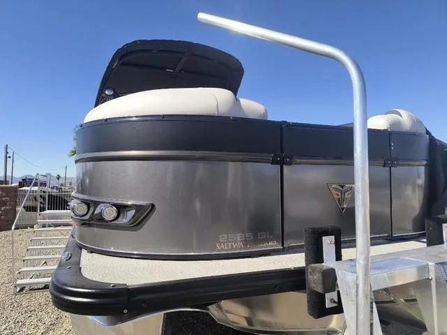 Slide: The Image of 2024 Tahoe Cascade Quad Lounge Windshield 25 FT interior with spacious seating. - 13