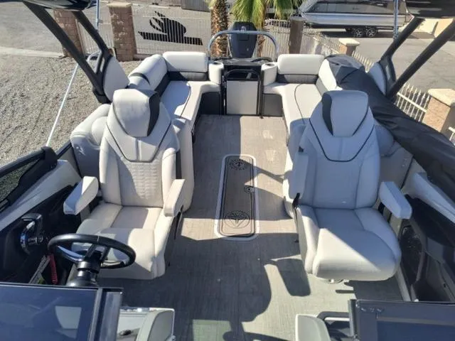 Slide: The Image of 2024 Tahoe Cascade Quad Lounge Windshield 25 FT pontoon boat interior with luxurious seating. - 18